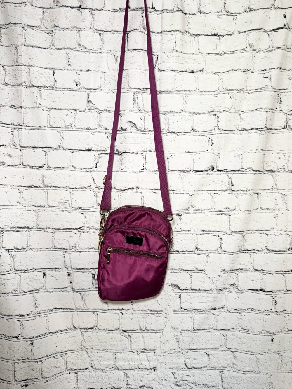 Sleek Magenta Crossbody Bag with Adjustable Strap